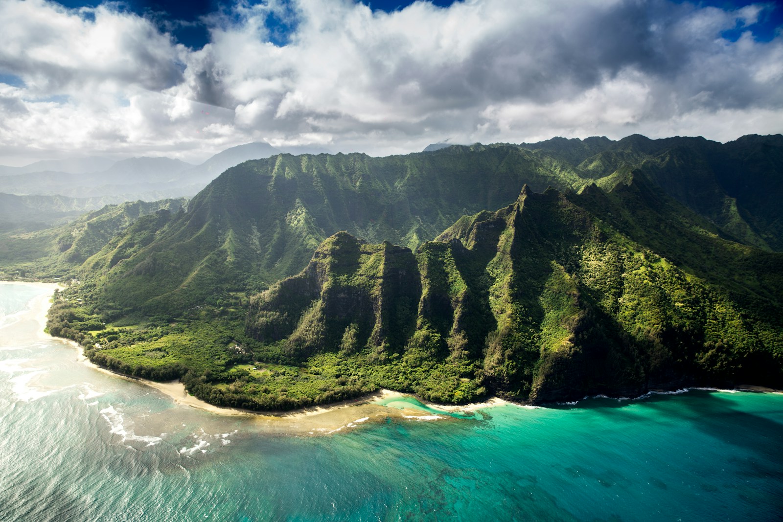 Hawaii.Aerial photography of green mountain beside body of water under white sky