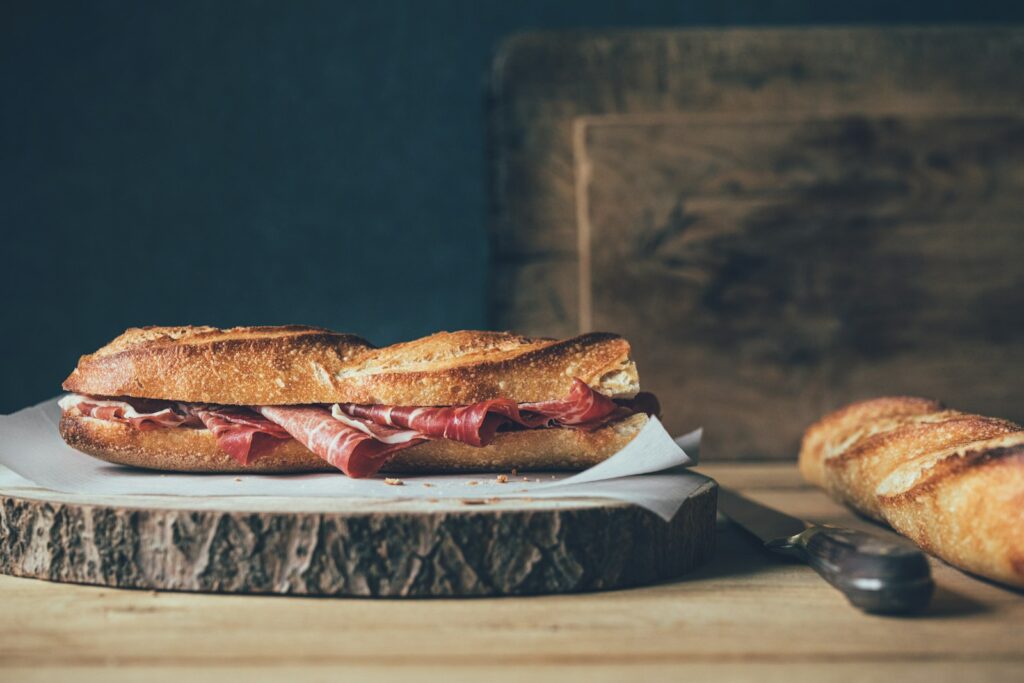 A large sandwich sitting on top of a cutting board