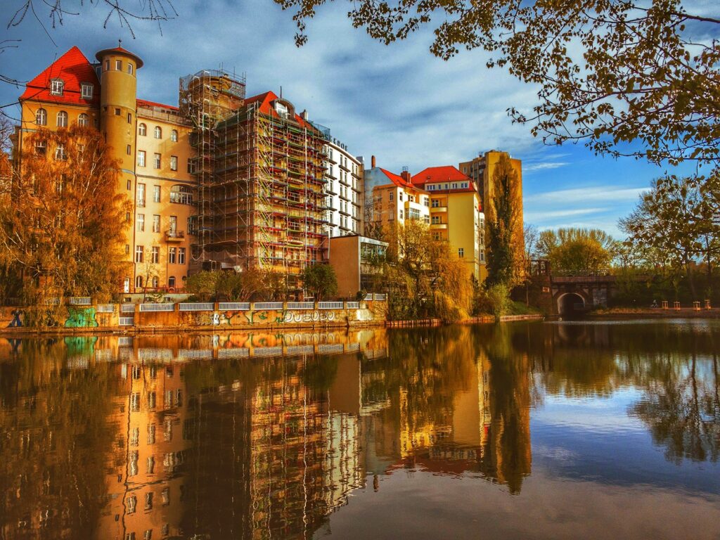 brown concrete building near body of water during daytime