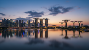 Marina Bay Sands and Supertree Grove beautifully illuminated at twilight in Singapore