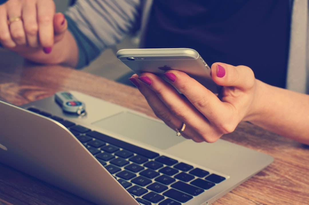 Traveler comparing hotel prices online on a laptop and smartphone