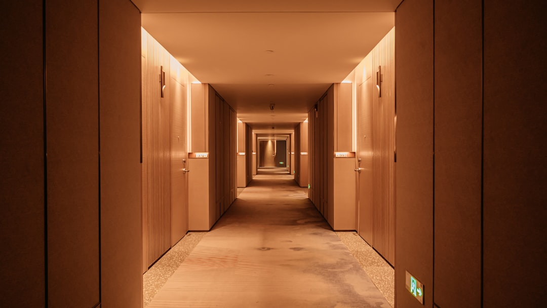 Empty hotel corridor illustrating why hotels can have unsold or unavailable rooms