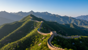 A breathtaking morning view of the Great Wall of China winding through lush green mountains
