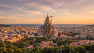 Panoramic view of the Barcelona skyline at sunset featuring the Sagrada Familia