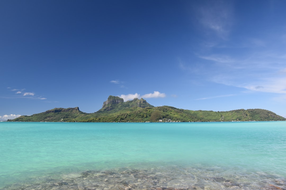 Bora Bora island surrounded by a clear blue lagoon in French Polynesia