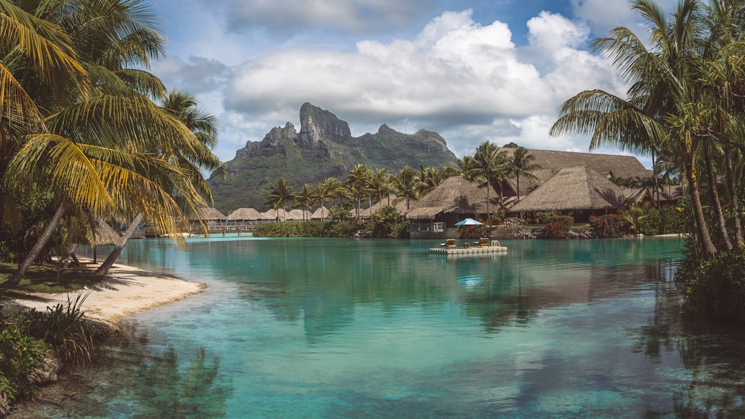 Overwater bungalows above the turquoise lagoon in Bora Bora French Polynesia