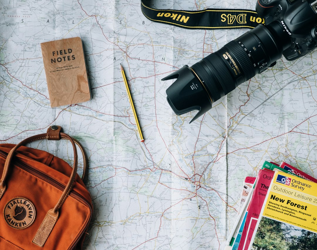 Travel planning desk with notebook, map and budget planning materials