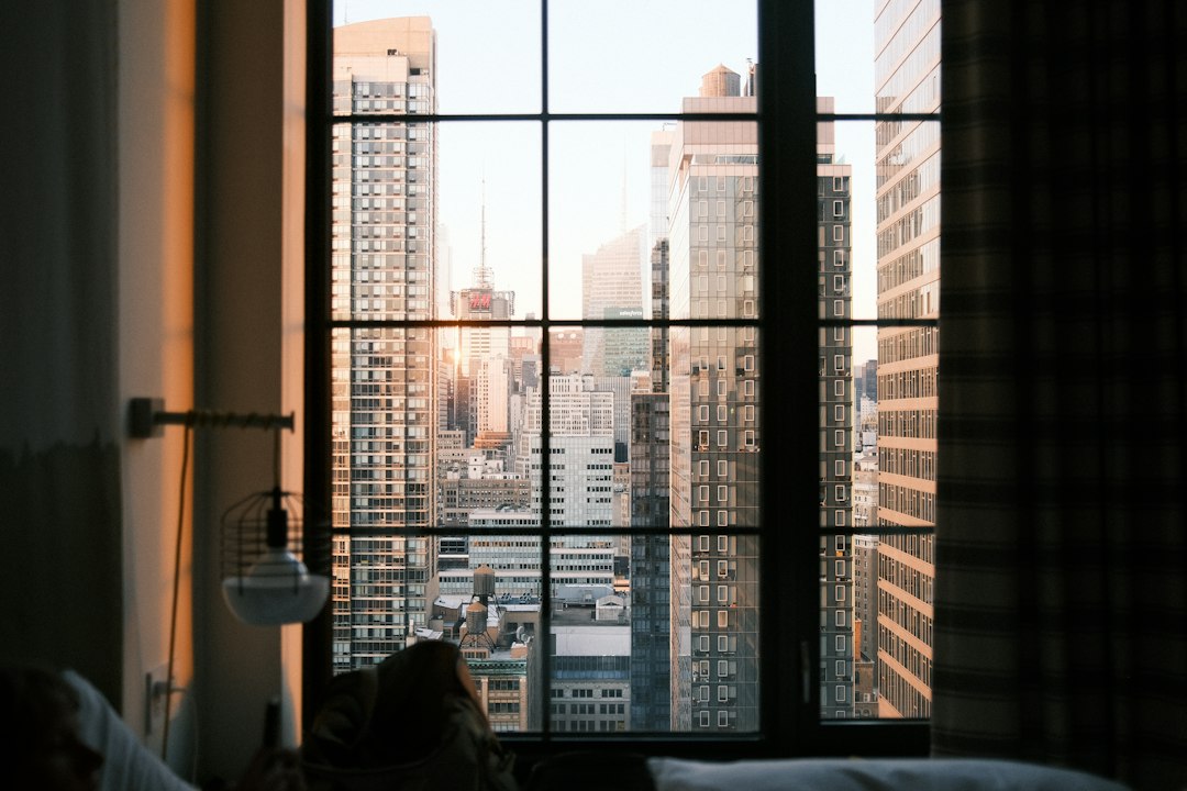 Hotel room overlooking a city illustrating hotel value and location