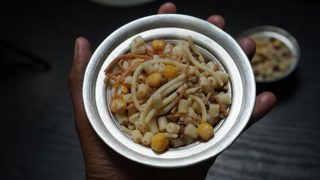 Bowl of Egyptian koshari with pasta and chickpeas