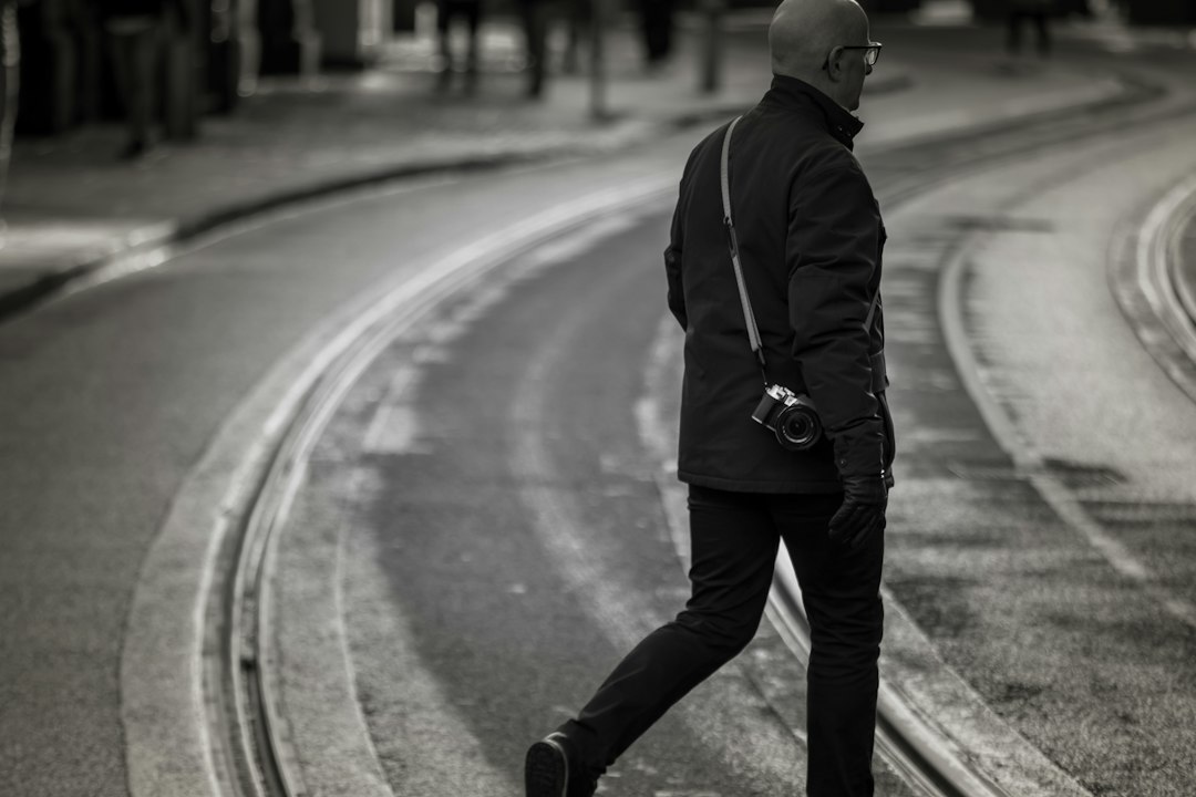 Traveler photographing a city street while on a trip